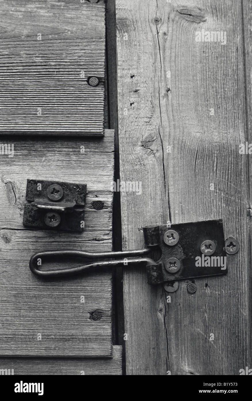 Black And White Close Up Of A Worn Wooden Shed Door With A