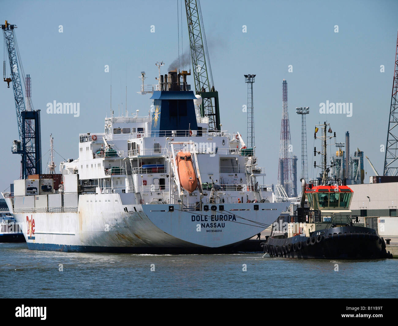 Dole ship being tugged in the port of Antwerp, Belgium Stock Photo