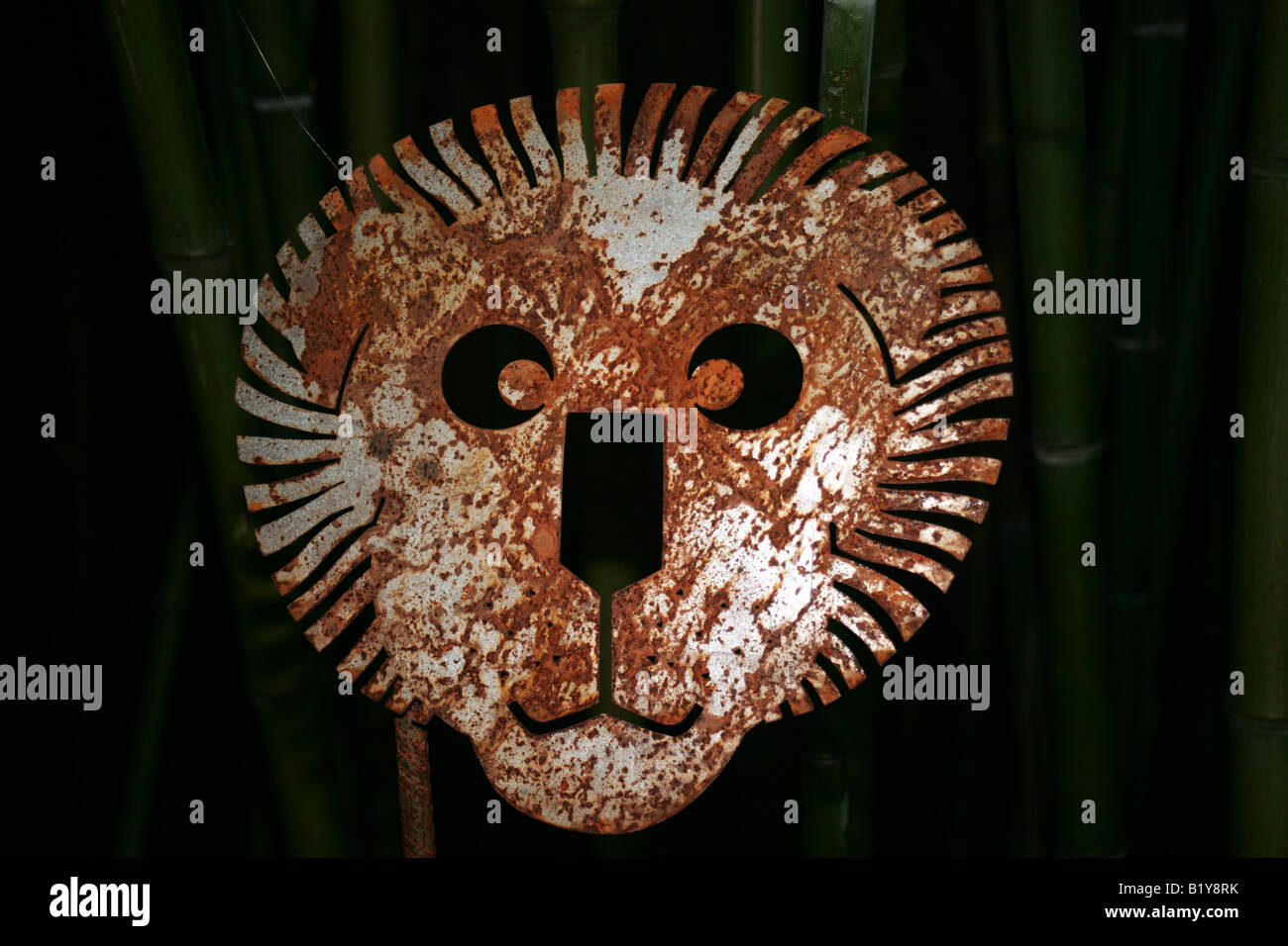 lion mask garden ornament in the Chaumont sur Loire Garden Festival France Stock Photo