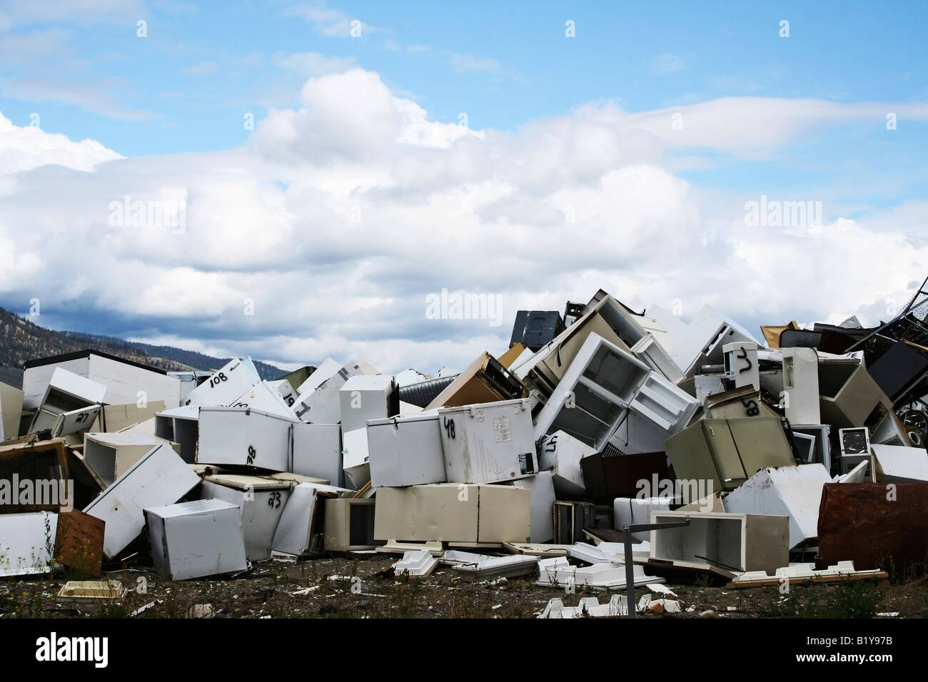Pile of refrigerators and freezers along with other metal for recycling Stock Photo