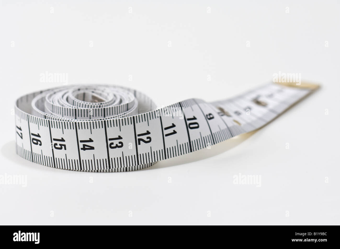 Imperial tailors tape measure, cut out or isolated against a white  background Stock Photo - Alamy