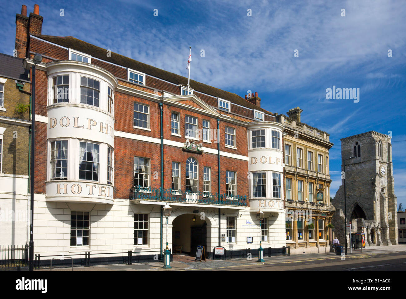 Historic Dolphin Hotel on Southampton High Street next door to the ruined shell of Holy Rood Church Hampshire England Stock Photo