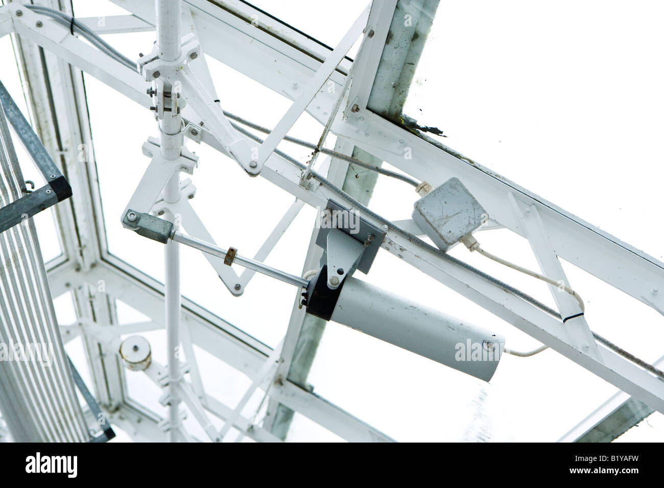 automatic window opening mechanism on an alpine greenhose Stock Photo