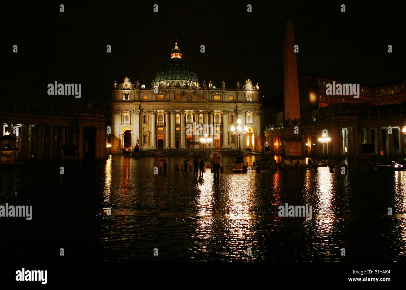 Night time reflections on rain soaked cobblestones, St Peters Basilica and Square, Vatican City, Rome, Italy Stock Photo