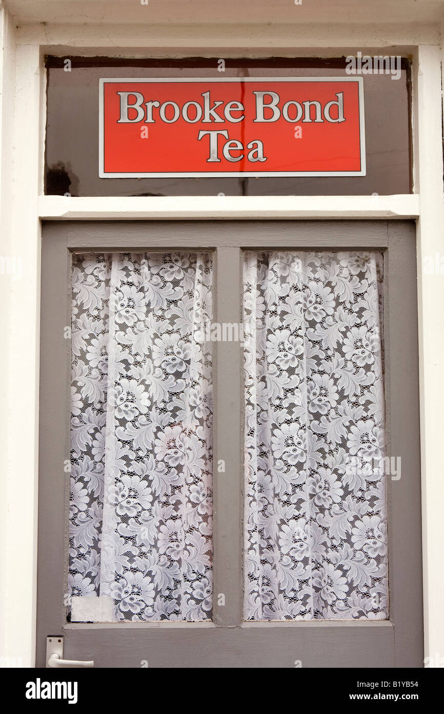 UK Wales Powys Rhayader town centre old Brooke Bond tea sign above former shop doorway Stock Photo