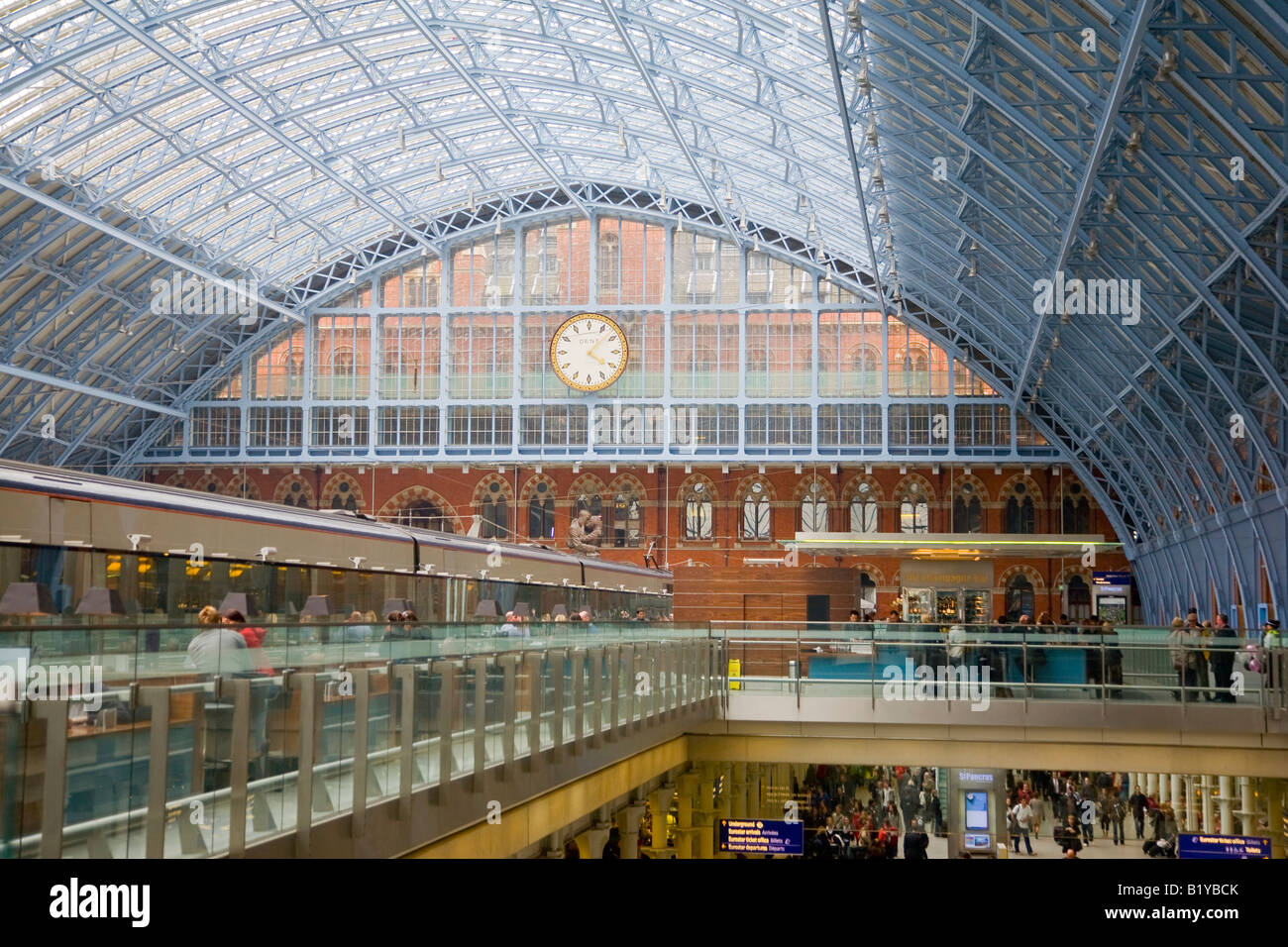 Interior showing the roof and clock in the rebuilt St Pancras Railway Station London England Stock Photo