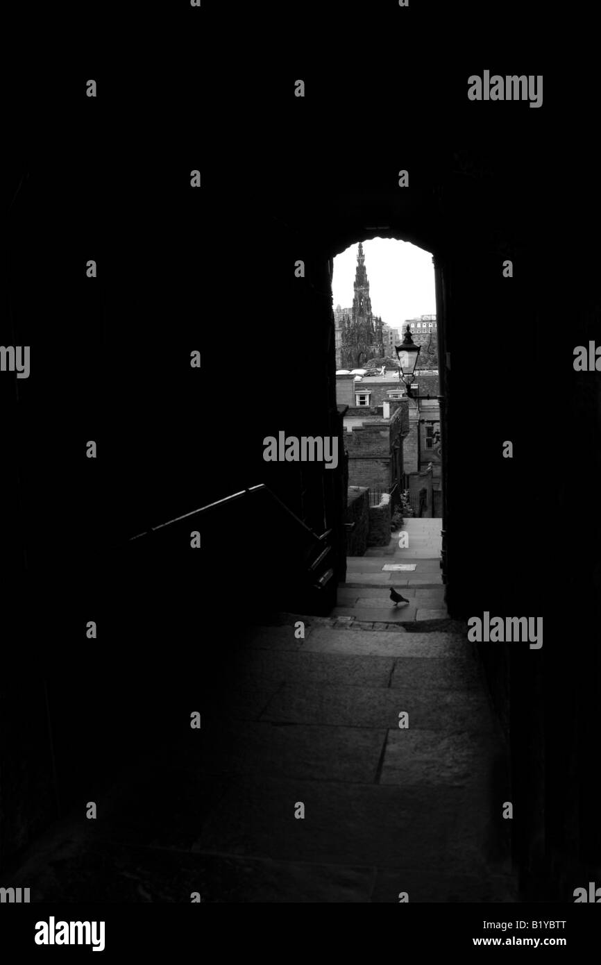 An unusual  view of Princes Street Edinburgh, Scotland, UK showing the Sir Walter Scott Monument - a framed shot from an alley Stock Photo