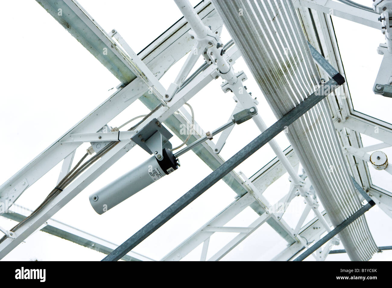 automatic window opening mechanism on an alpine greenhose Stock Photo