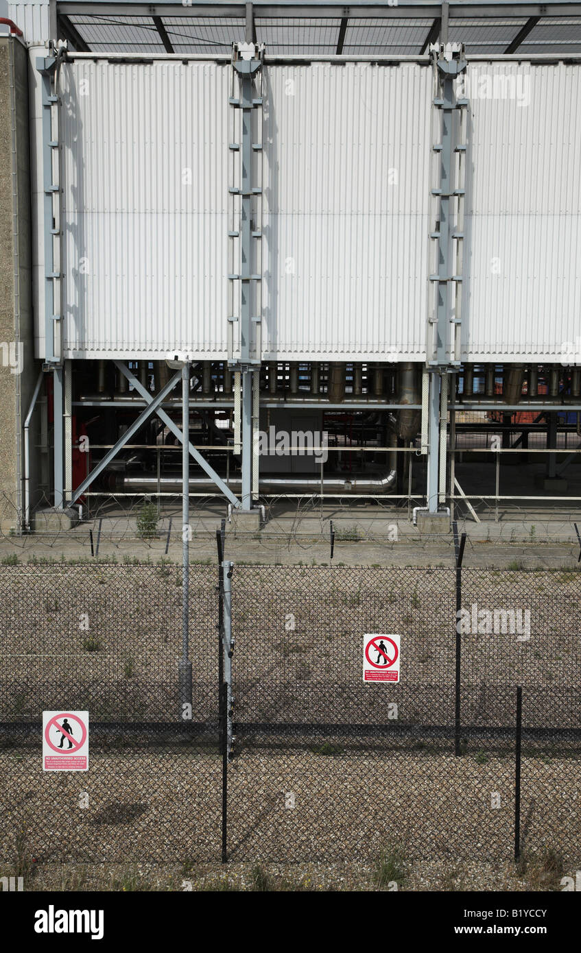 Keep Out signs barbed wire fencing industrial buildings Sizewell nuclear power station Stock Photo