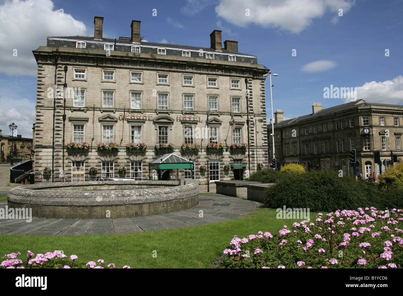 Town of Huddersfield, England. The Grade II listed Victorian style George Hotel at Saint George’s Square and Railway Street. Stock Photo