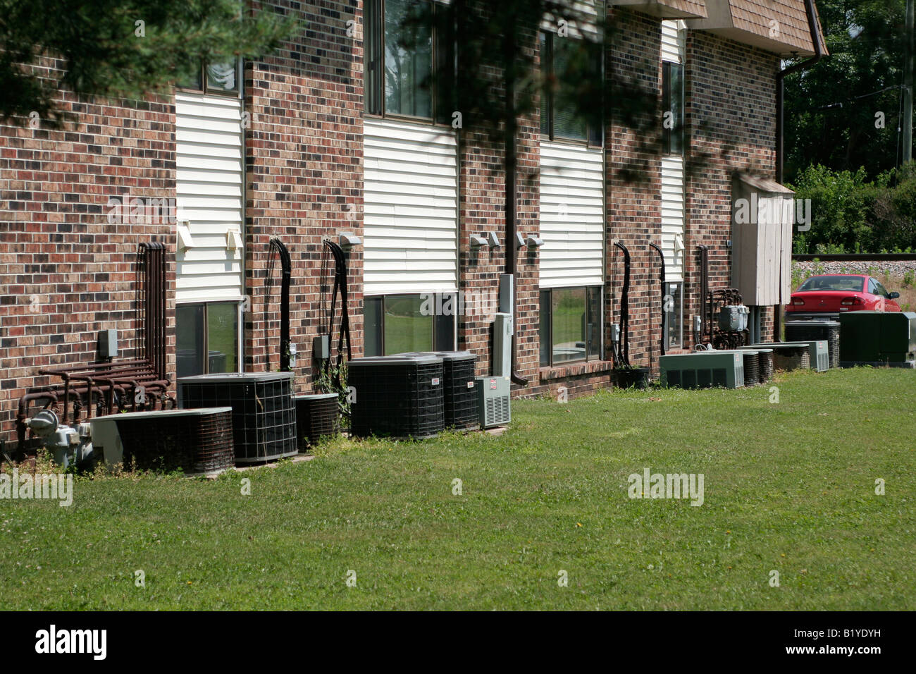 Heat pump units outside an apartment building Stock Photo