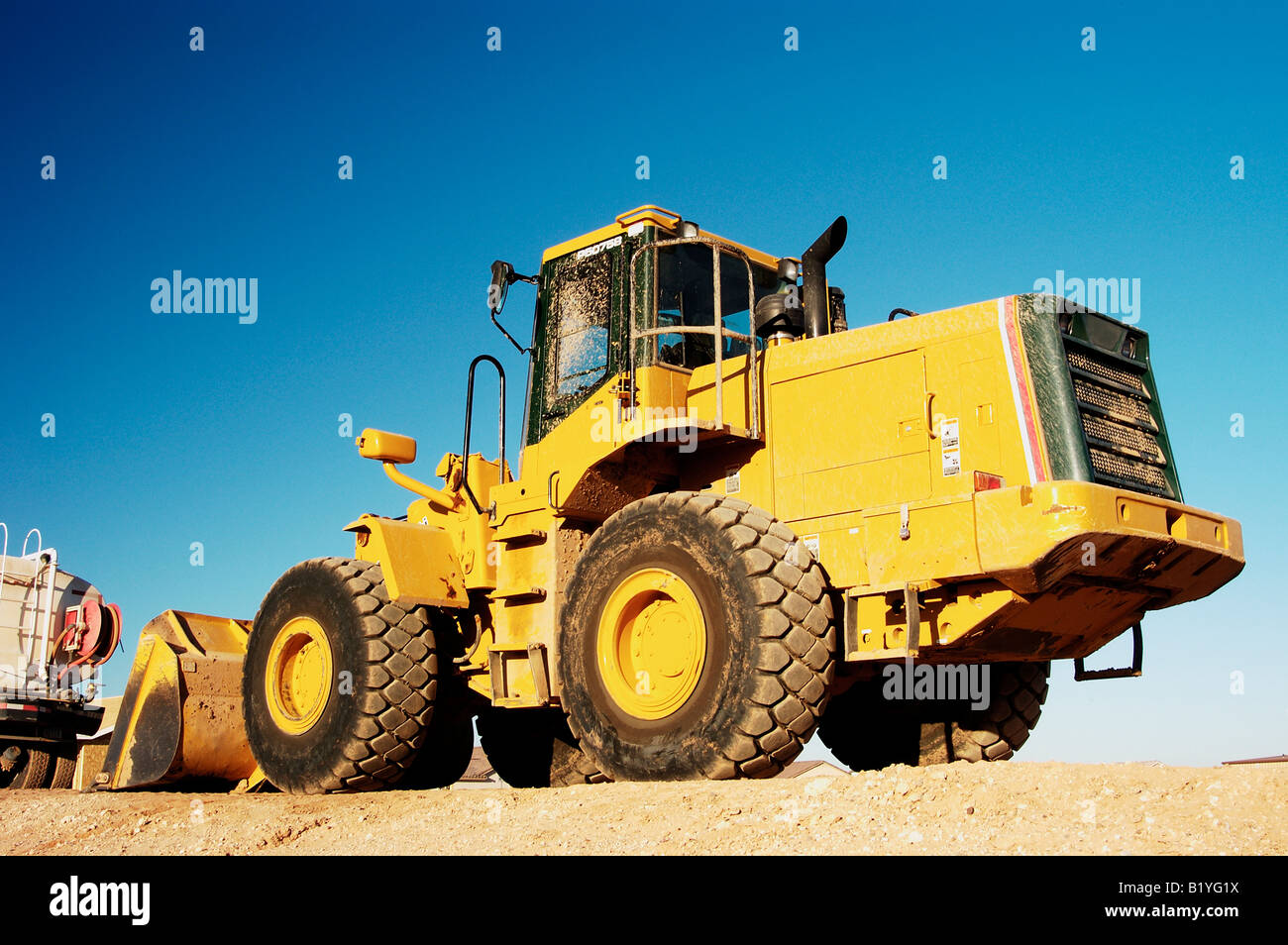 Heavy construction equipment parked on a residential construction site