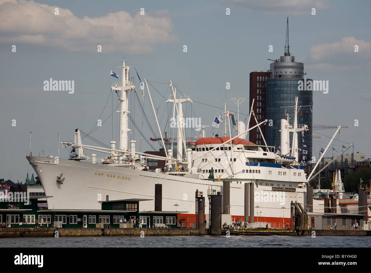 The museum freighter Cap San Diego in front of the tower of the Hanseatic Trade Center in the port of Hamburg Stock Photo