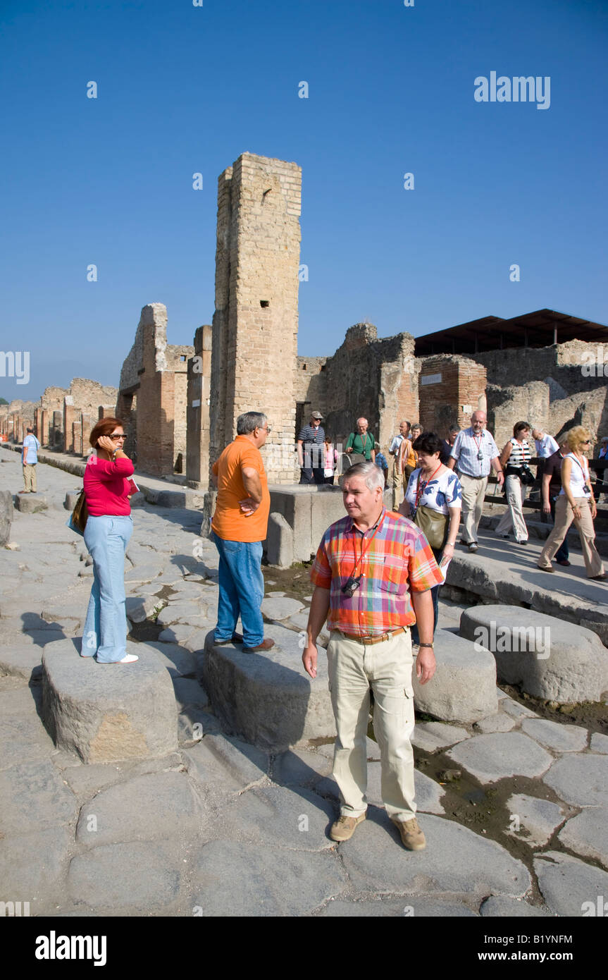 Tourists and Pompeii s streets Pompeii Campania Italy Stock Photo
