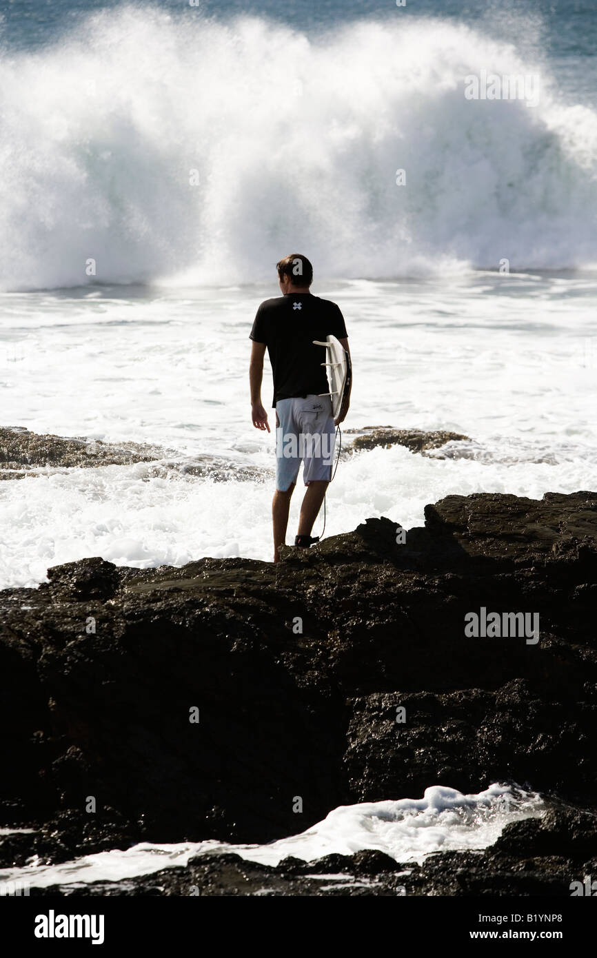 Surfer standing in rough hi-res stock photography and images - Alamy