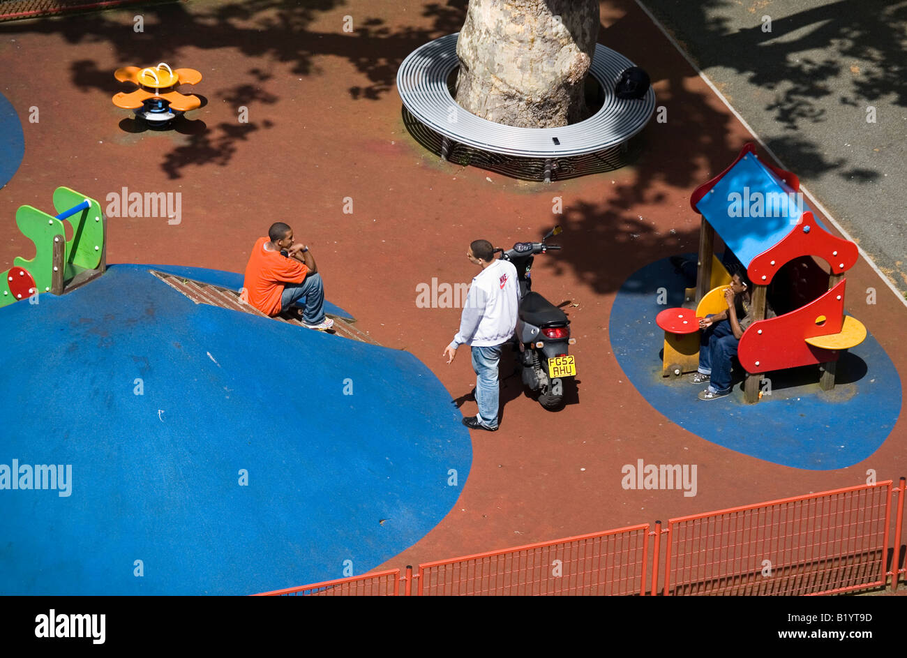 In Britains Playgrounds Bringing In >> Teenagers Hanging Around In Children Playground London England Stock In Britains Playgrounds Bringing In >> Teenagers Hanging Around In Children Playground London England Stock