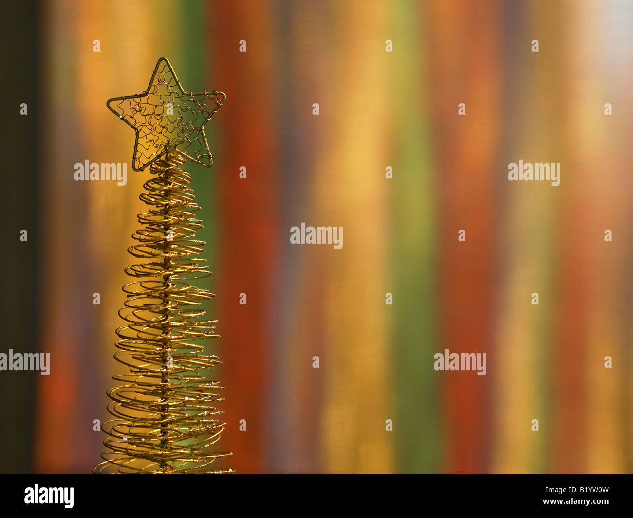 golden Christmas tree with colourful background Stock Photo - Alamy