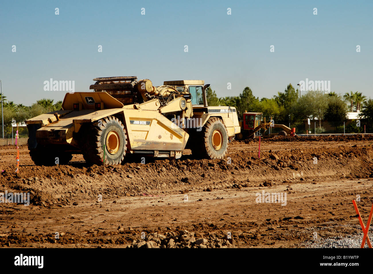 Heavy construction equipment parked on a residential construction site