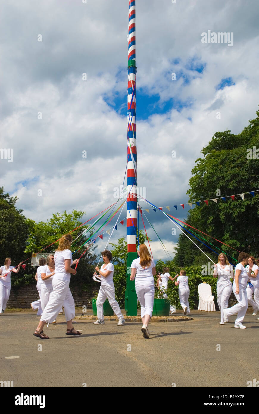 Offenham Ladies dancing around the Maypole during the annual Wake week celebrations held in June Stock Photo