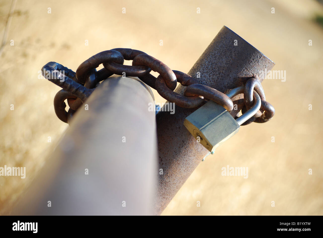 Close-up of chained and locked metal gate Stock Photo