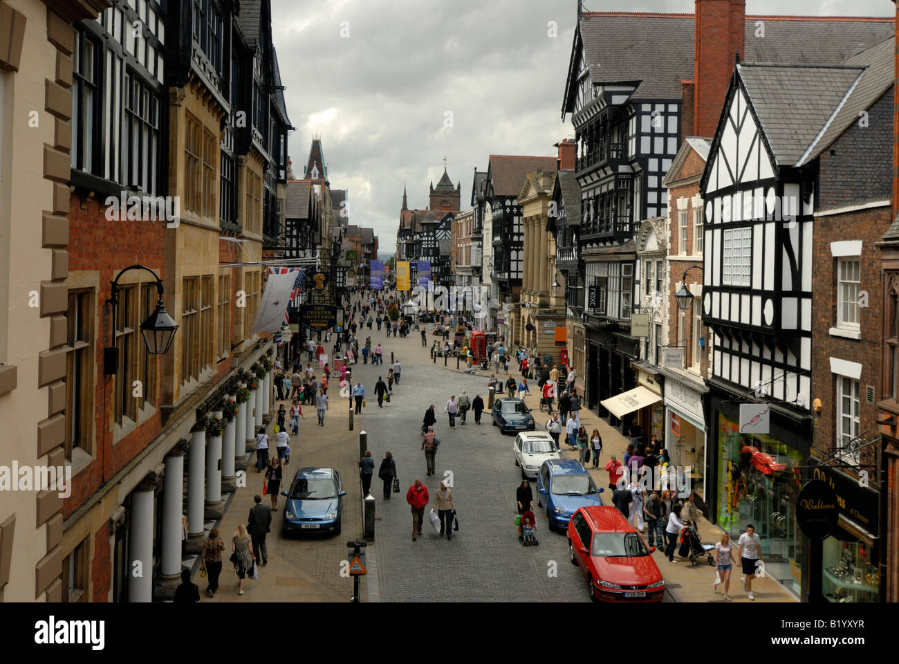 Chester Eastgate Street viewed on busy shopping day histioric buildings Stock Photo