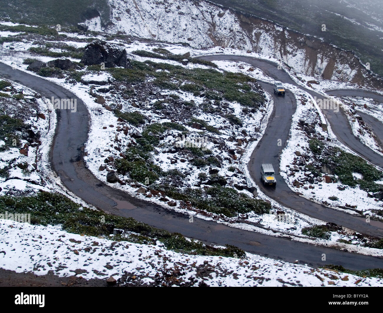 snow along the curvy roads of northern Sikkim in India Stock Photo