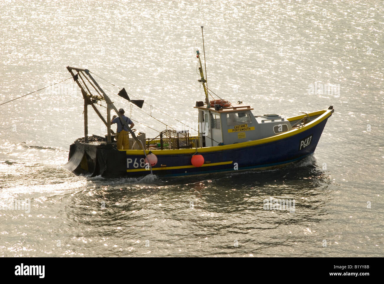 Fisherman in boat fishing hi-res stock photography and images - Alamy