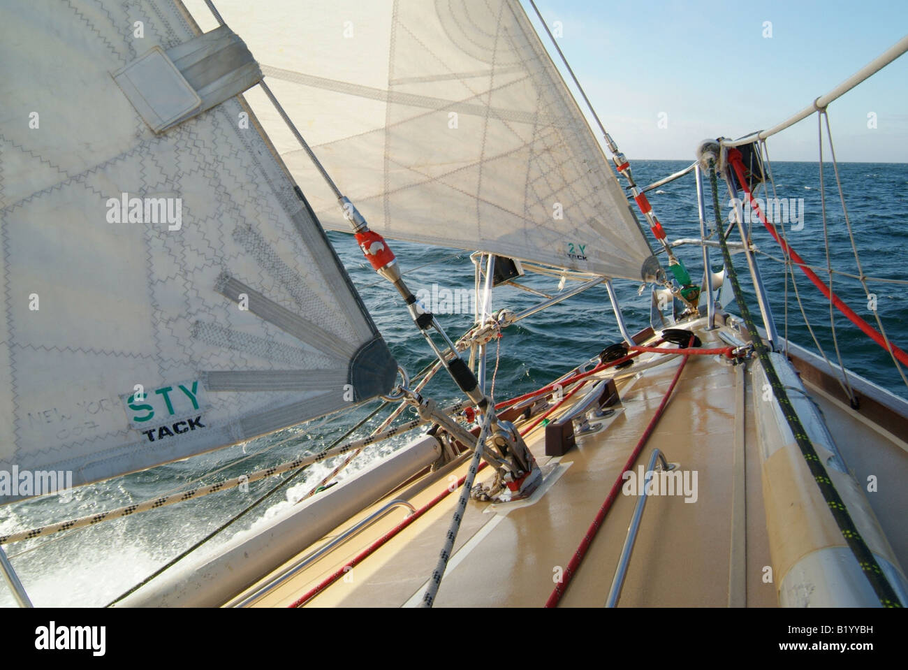 Foredeck of yacht at sea showing details of sail attachment points and