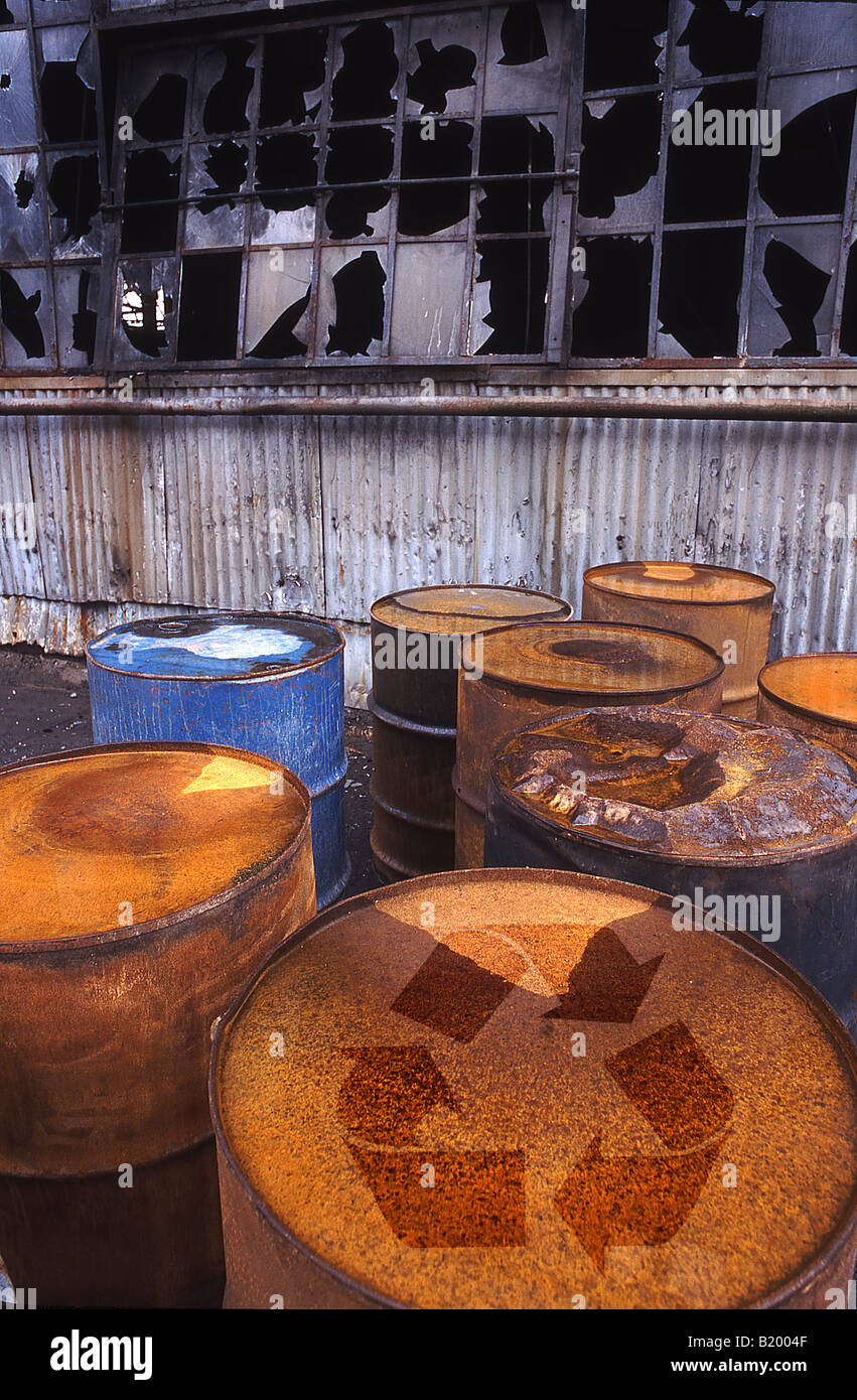 Old storage drums with recycle symbol Stock Photo Alamy