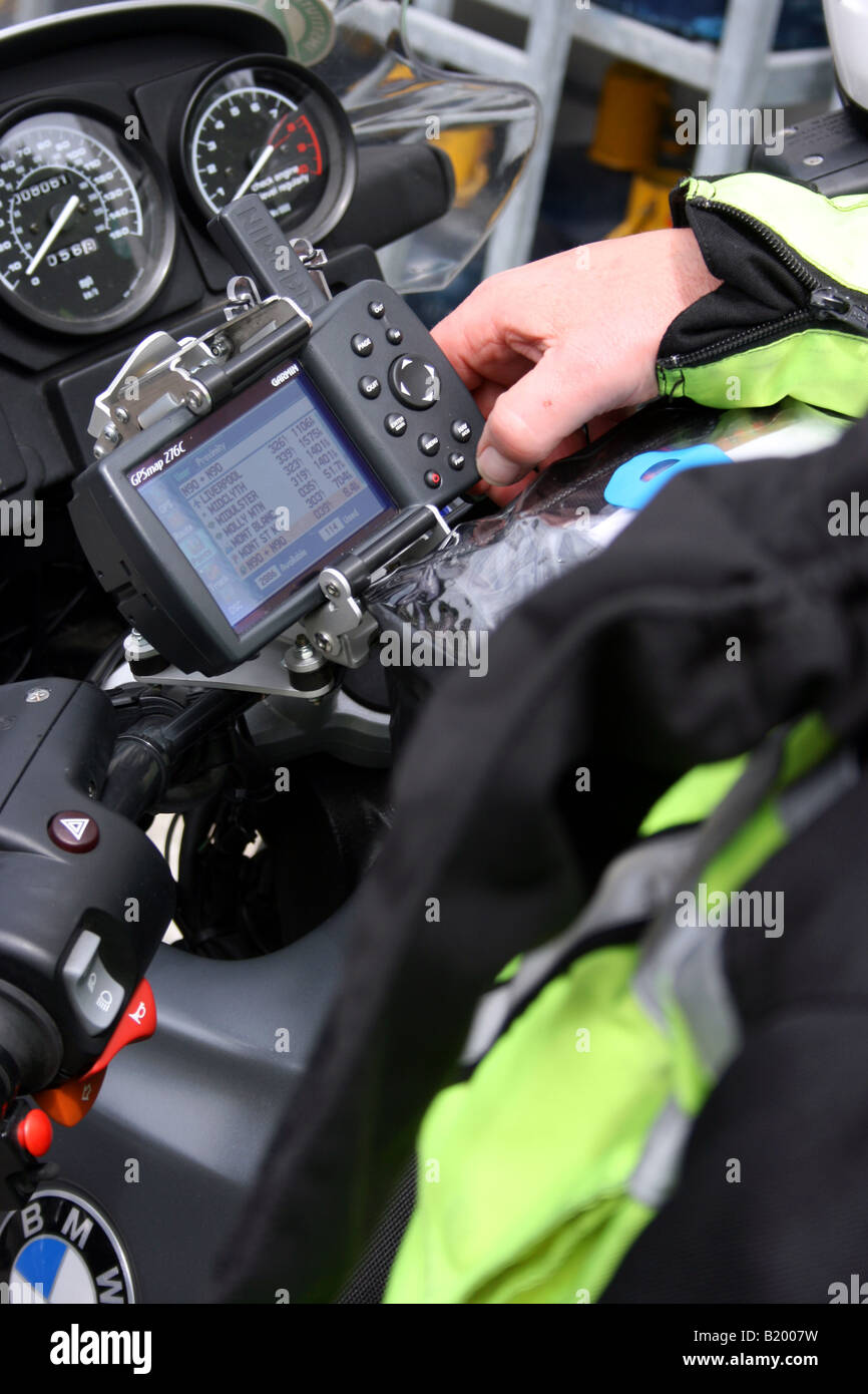 Graph Rider Motorcycle Navigation motorcyclist operating satellite navigation system Stock Photo - Alamy