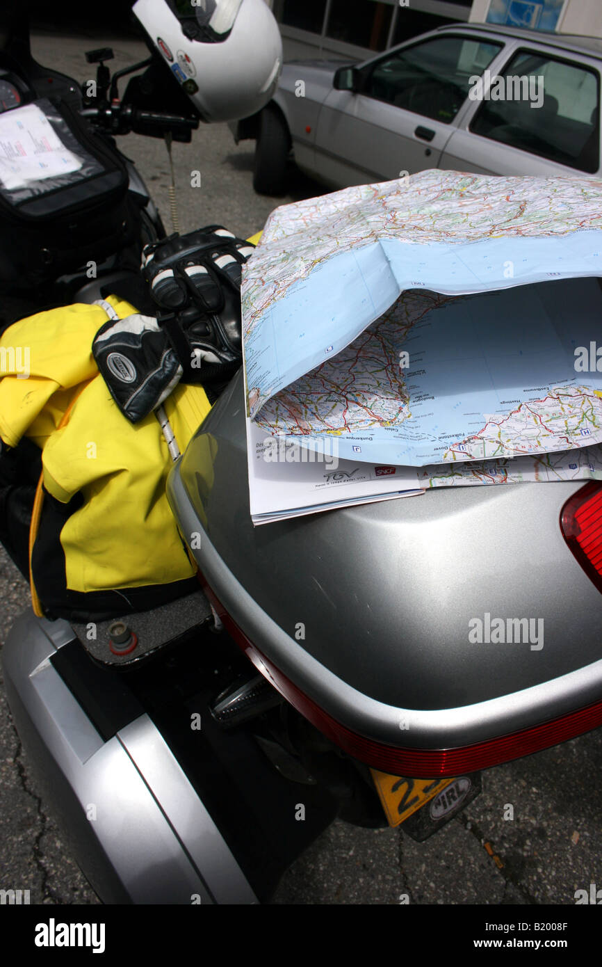 touring motorcycle with folded map on top box Stock Photo - Alamy
