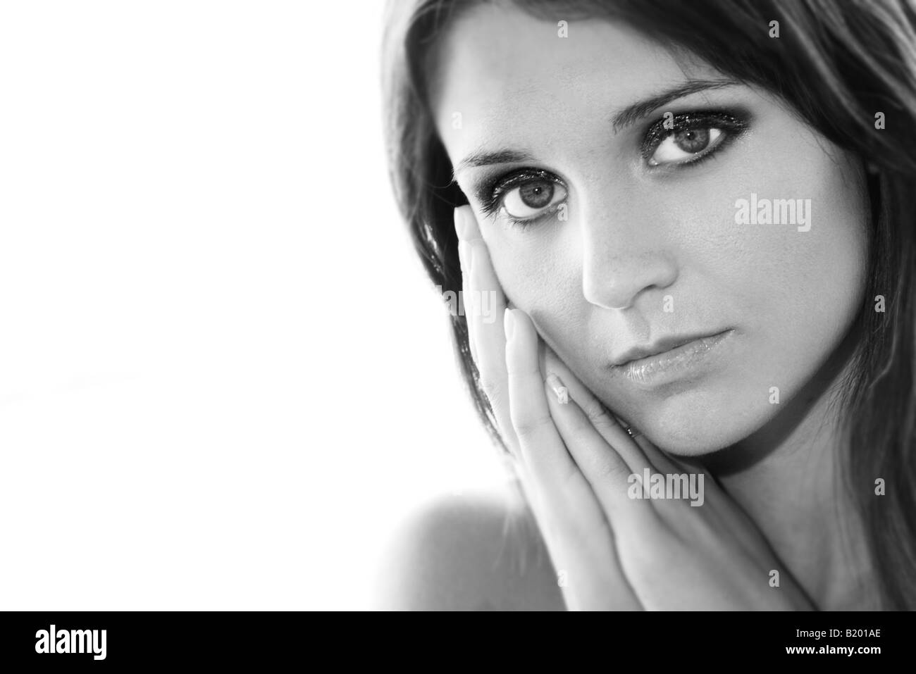 woman resting hands on the side of her face Stock Photo Alamy