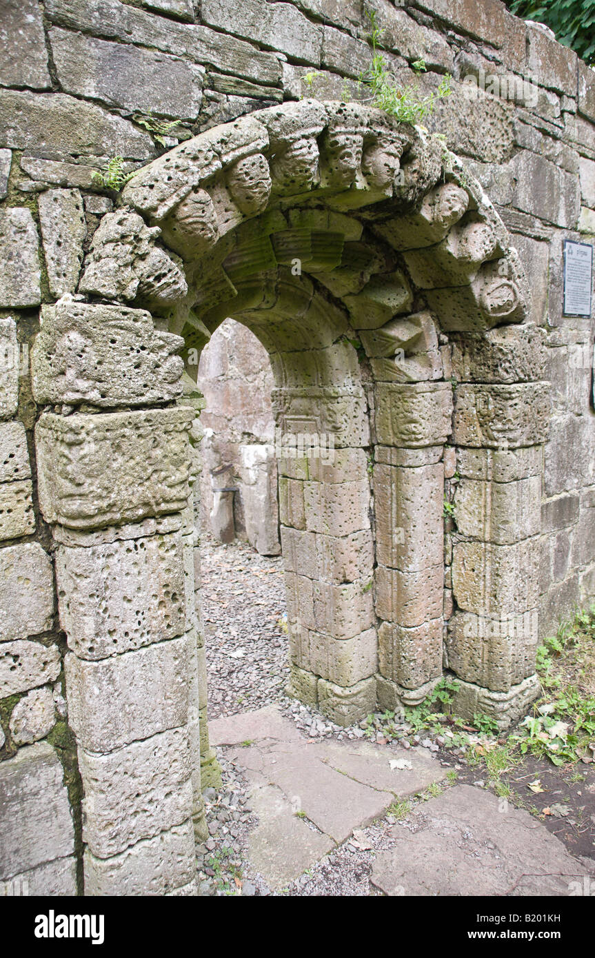 Carved doorway and flagged path at Teampall Naomh (Church of the Saints), Inchagoil Island, Lough Corrib, Ireland (500AD) Stock Photo