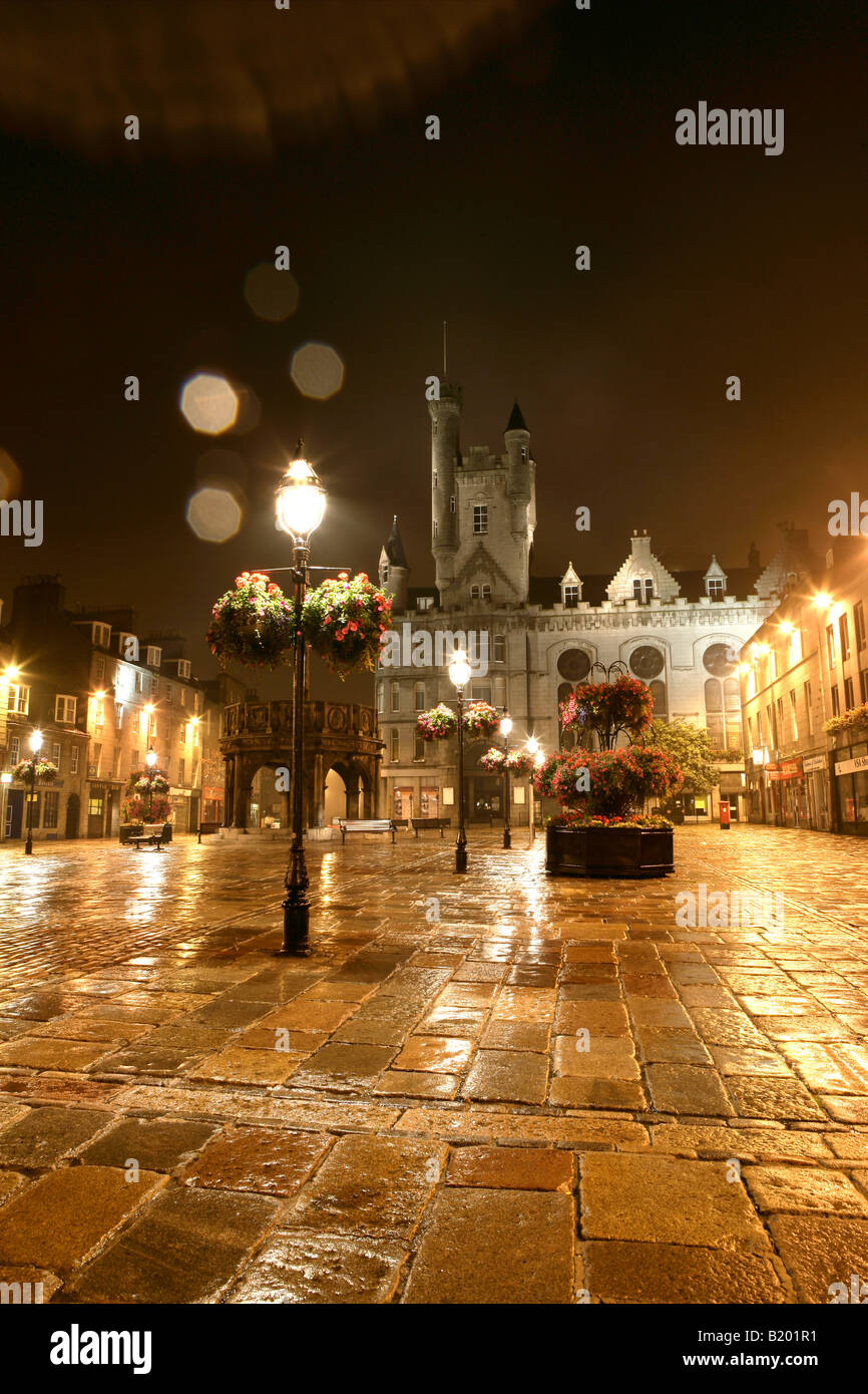 City of Aberdeen, Scotland. Evening rainy view of Castlegate with the Mercat Cross, Market Cross, and Salvation Army Citadel. Stock Photo