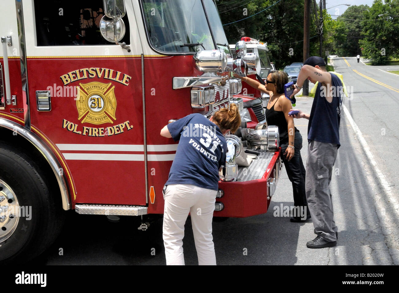 volunteers firefighters polish the firetruck at Beltsville Fire Dept in