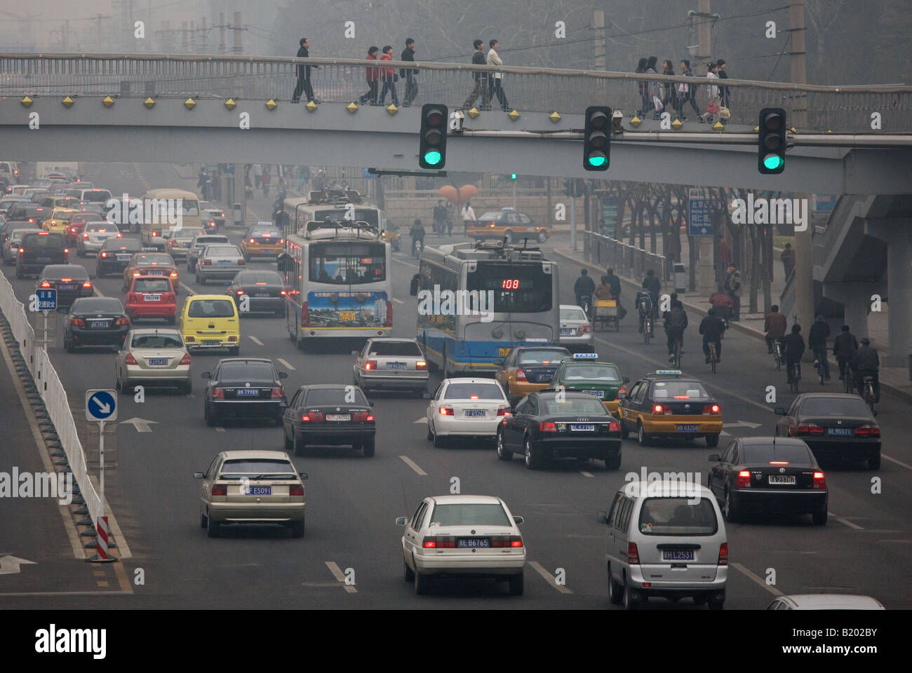 Pedestrians Use Footbridge Over Heavy Traffic Congestion And Air Stock ...