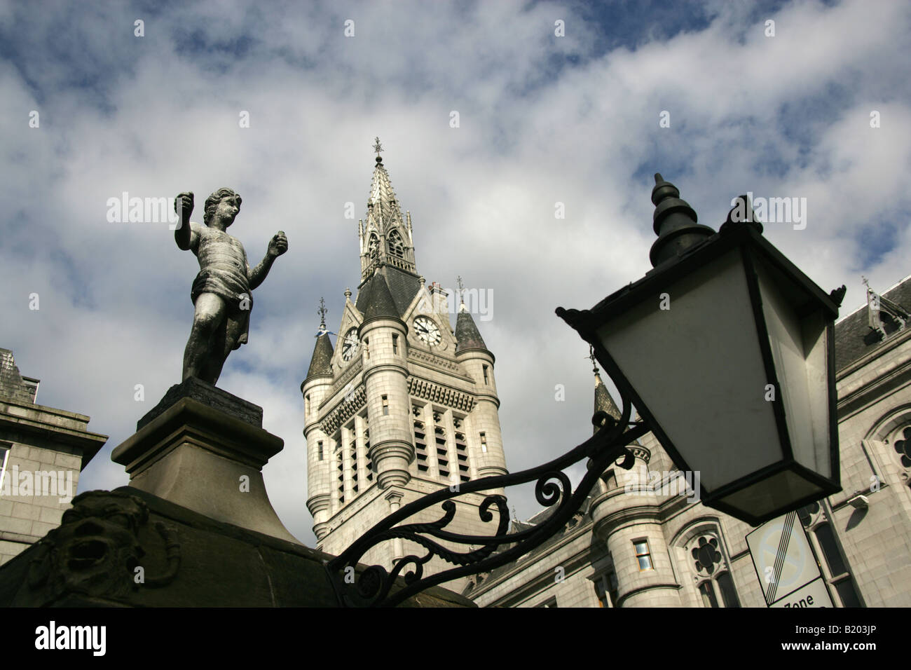 City of Aberdeen, Scotland. The Mannie statue at Castlegate Well with the Town House clock tower in the background. Stock Photo