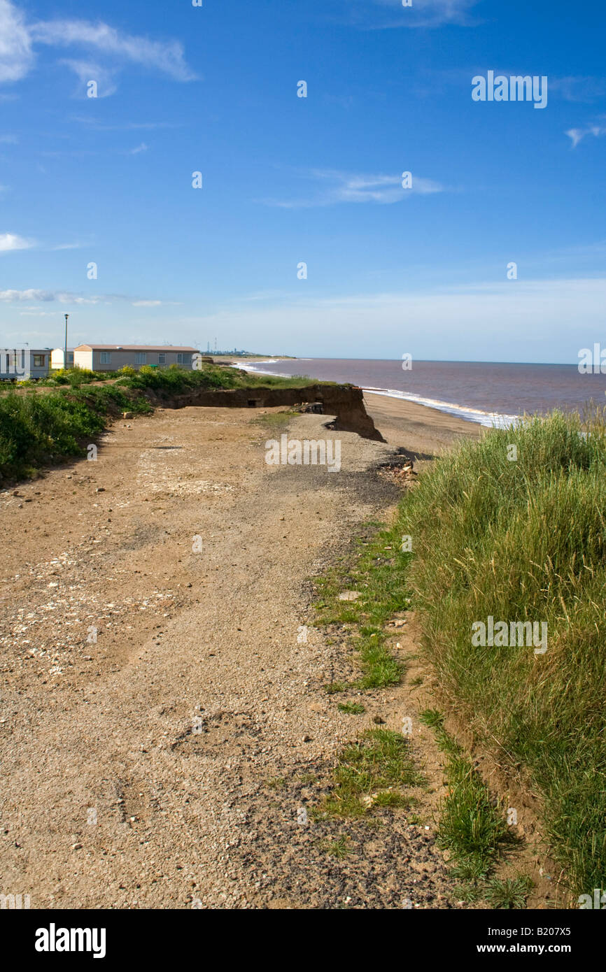 a road collapse due to cliff erosion at kilnsea yorkshire Stock Photo