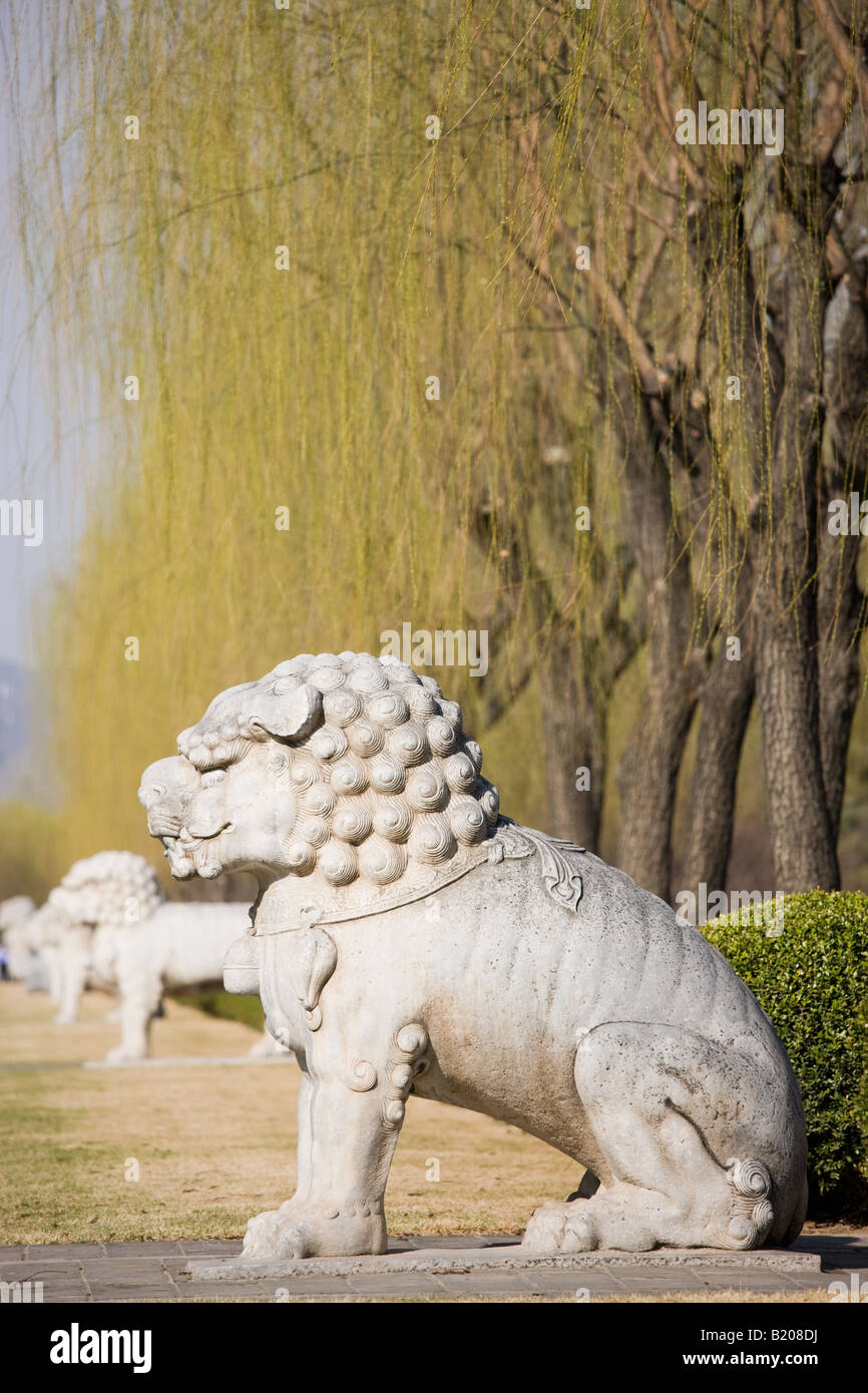 Statue of a resting lion Spirit Way avenue Ming Tombs Beijing Peking China Stock Photo