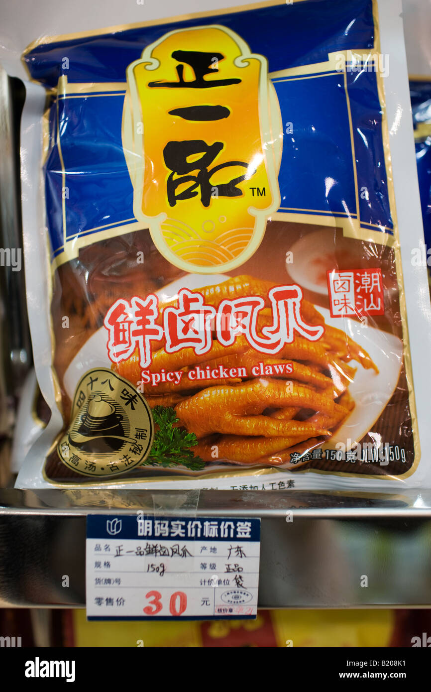 Bag of spicy chicken claws on sale in souvenir shop Shanghai China Stock Photo