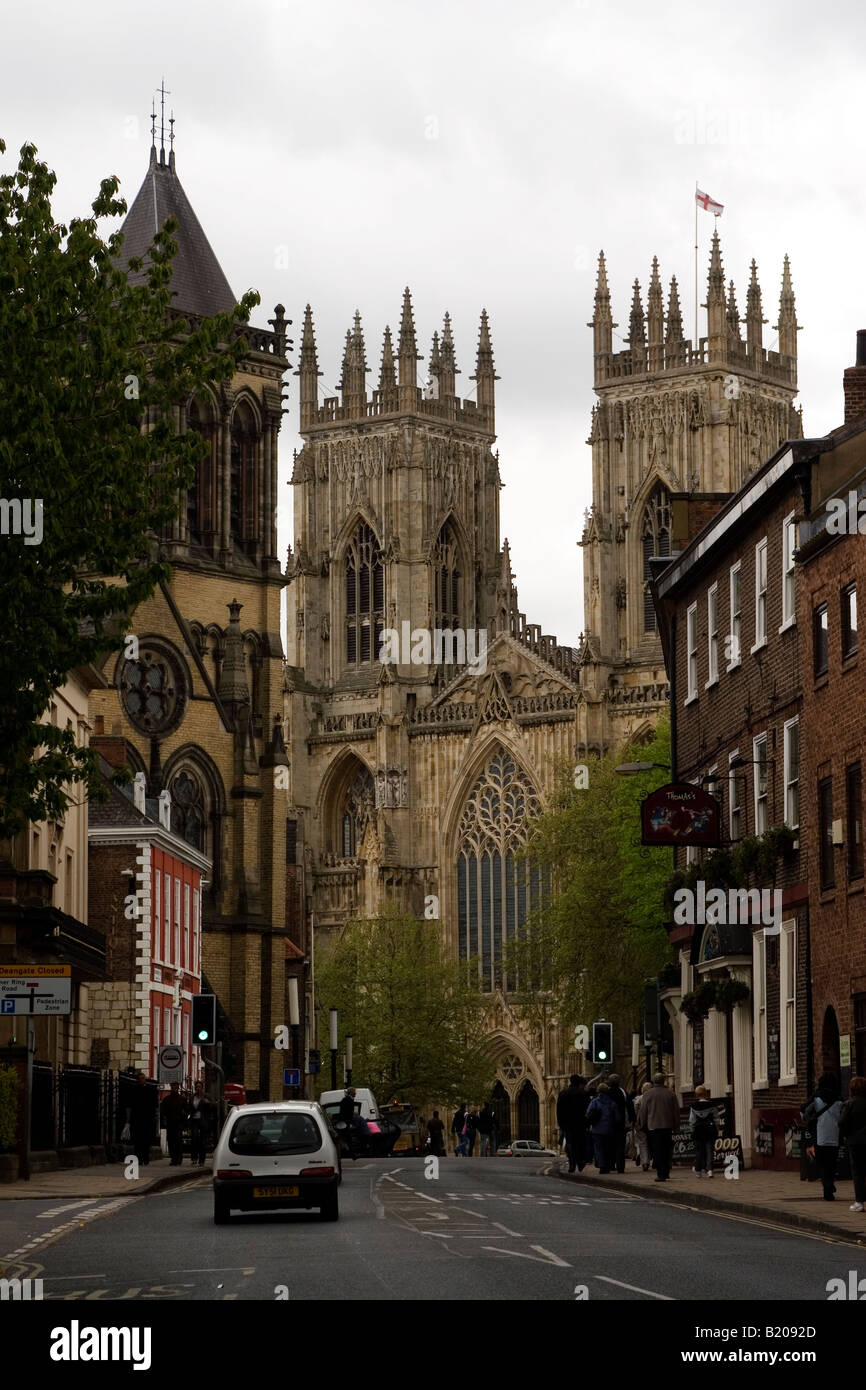 A car drives towards the Minster in York, Yorkshire. Cities are
