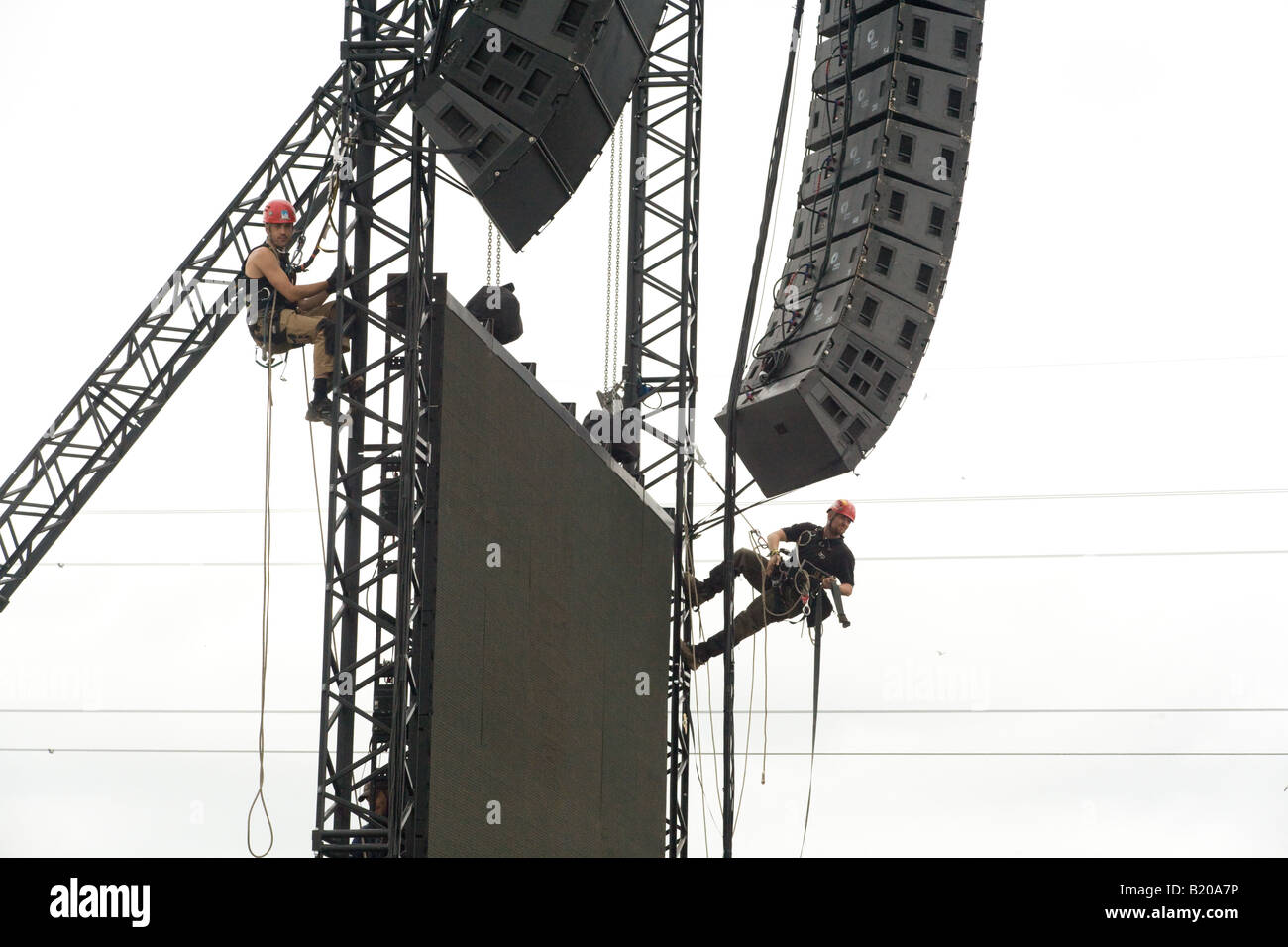 Climbers fixing the speakers on the Pyramid stage. Glastonbury Festival  2008 Stock Photo - Alamy