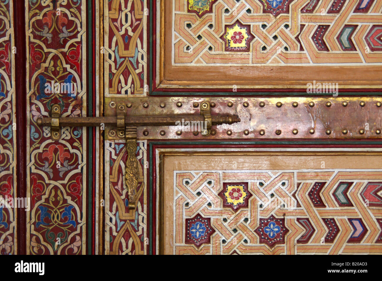 Detail of brass bolt and painted wooden door, Morocco Stock Photo Alamy