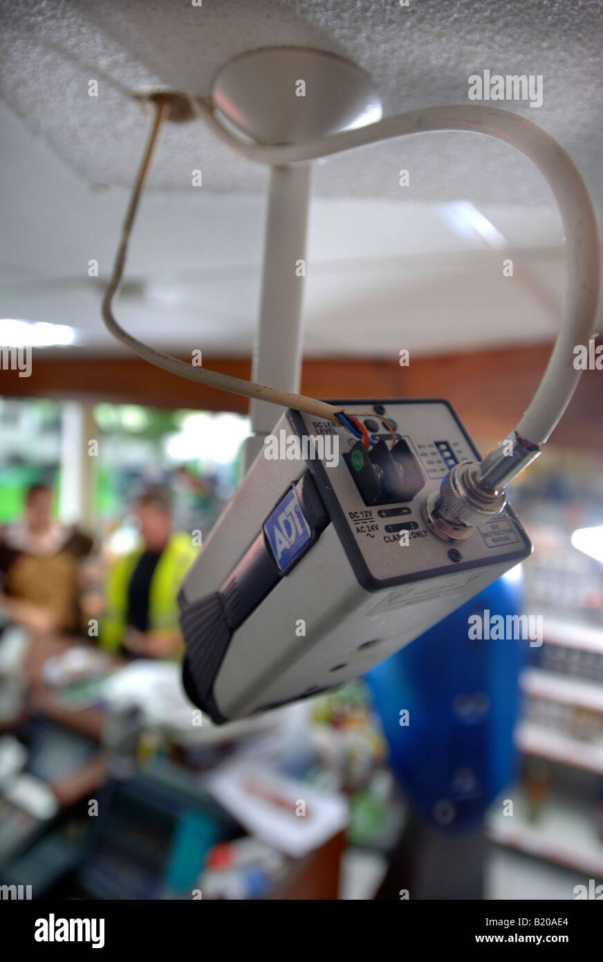 A CCTV SECURITY CAMERA OVER A PETROL STATION CHECKOUT UK Stock Photo