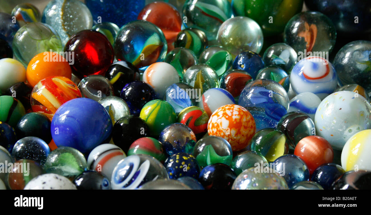 A childs' collection of colourful marbles ( side-on view ). Stock Photo