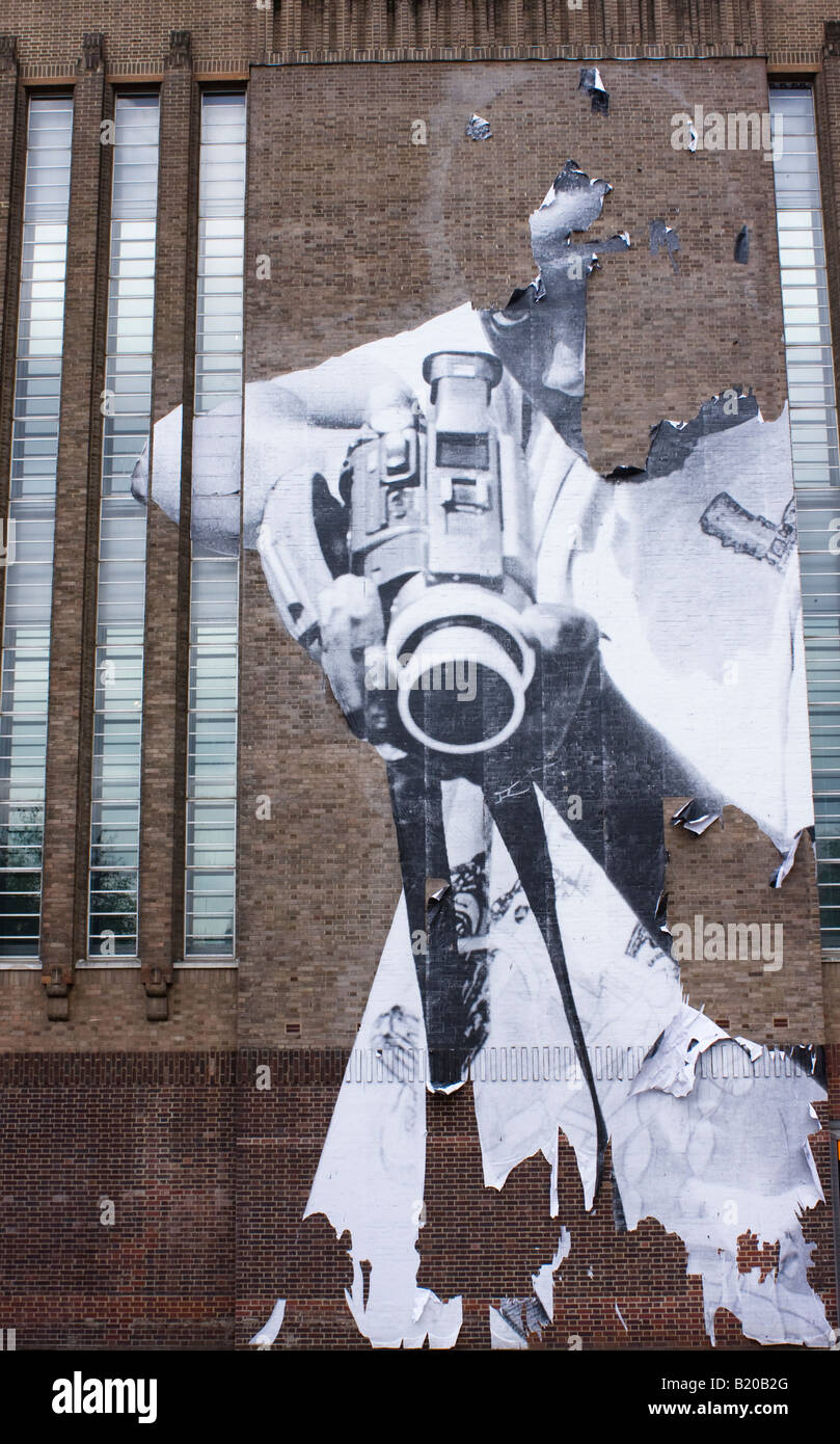 Street Art Depicting a Young Adult Male with Aggressive Pose, on the Outside Wall of the Tate Modern Art Gallery, London. Stock Photo