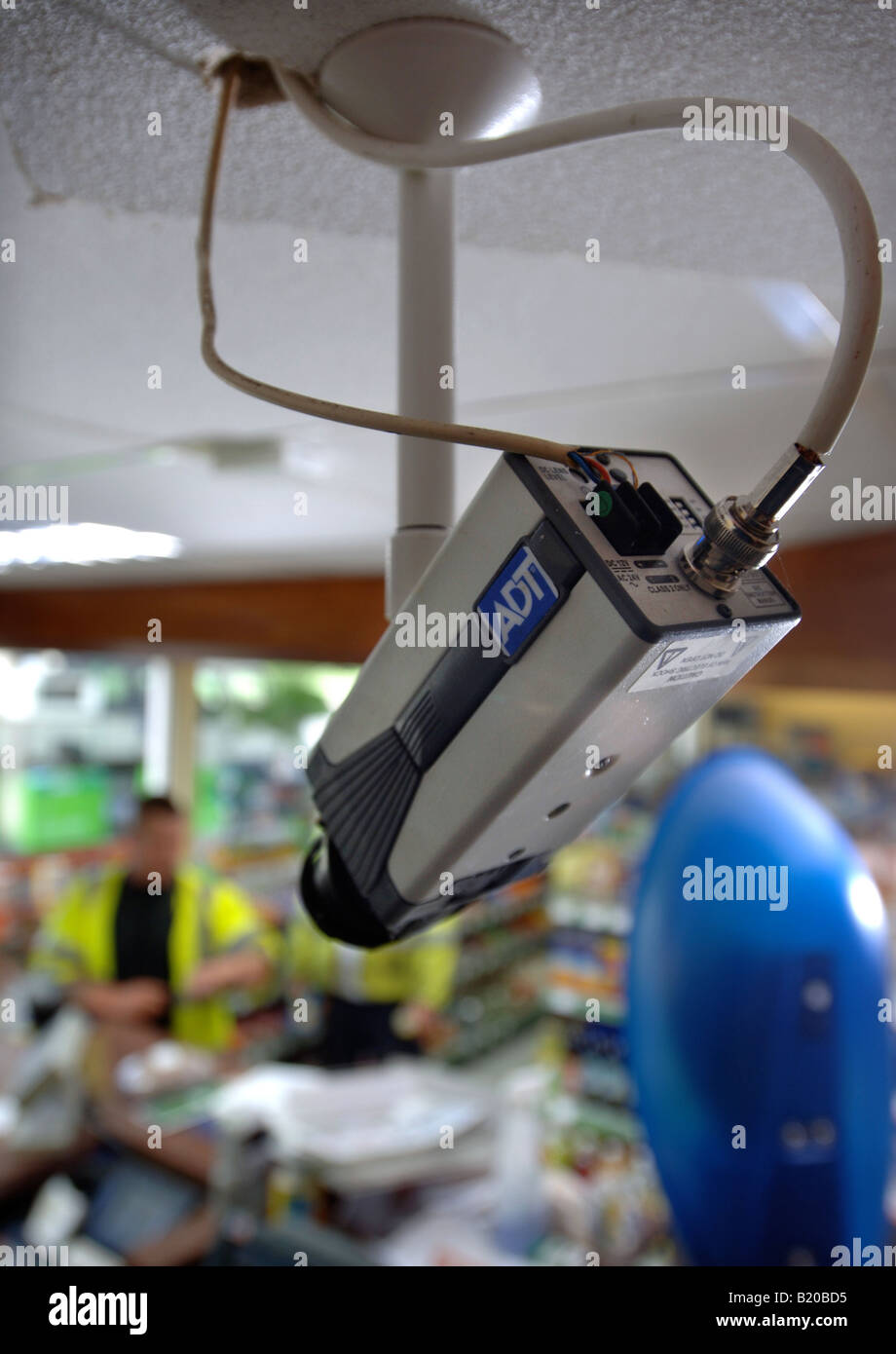 A CCTV SECURITY CAMERA OVER A PETROL STATION CHECKOUT UK Stock Photo