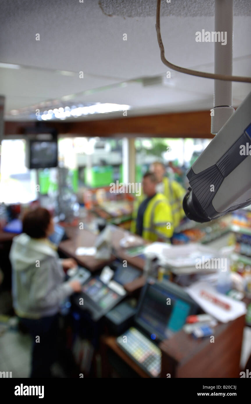 A CCTV SECURITY CAMERA OVER A PETROL STATION CHECKOUT UK Stock Photo