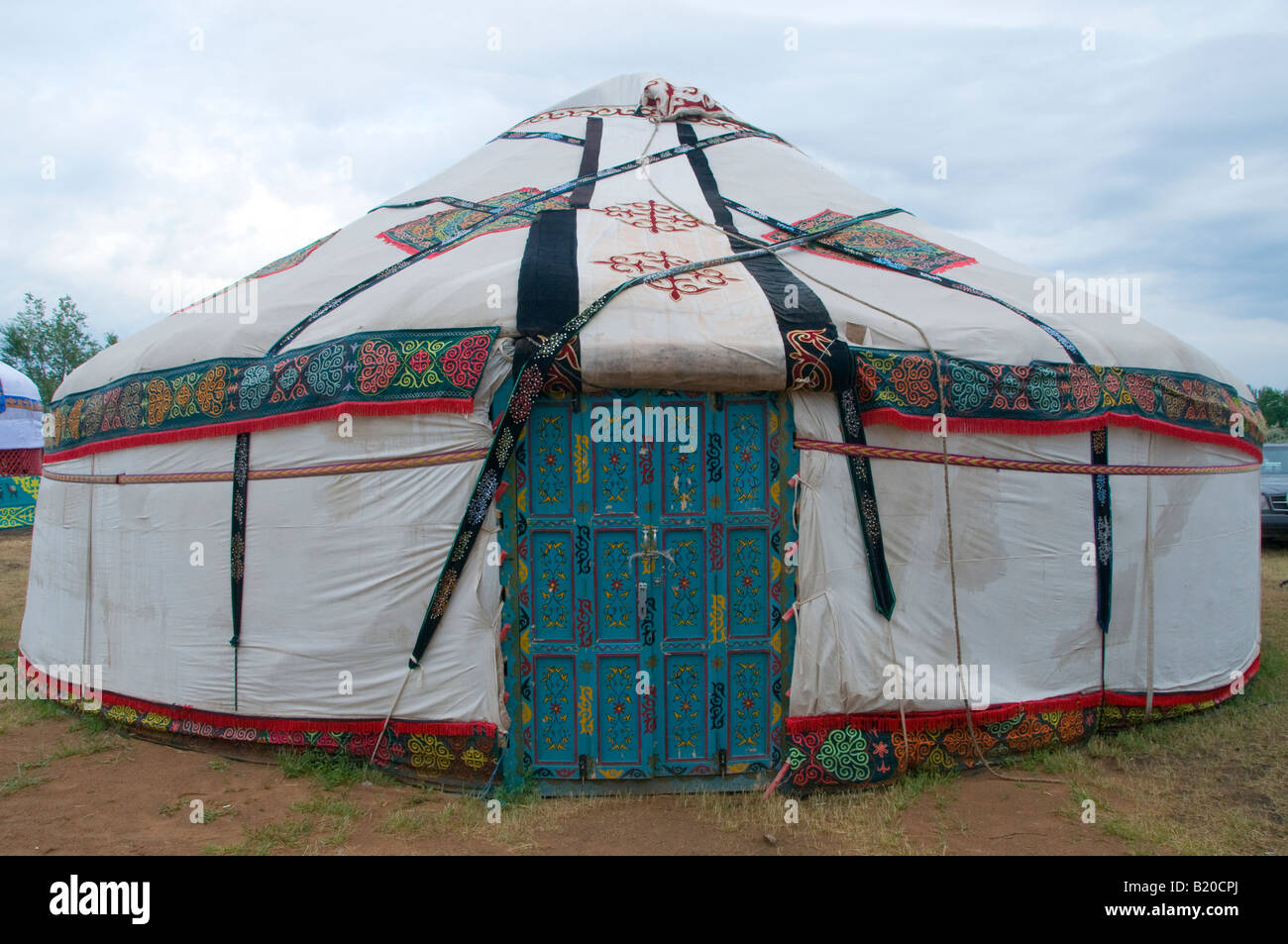 A traditional yurt or ger which portable, round tent covered with felt and used as a dwelling by nomads in the steppes of Central Asia. Stock Photo