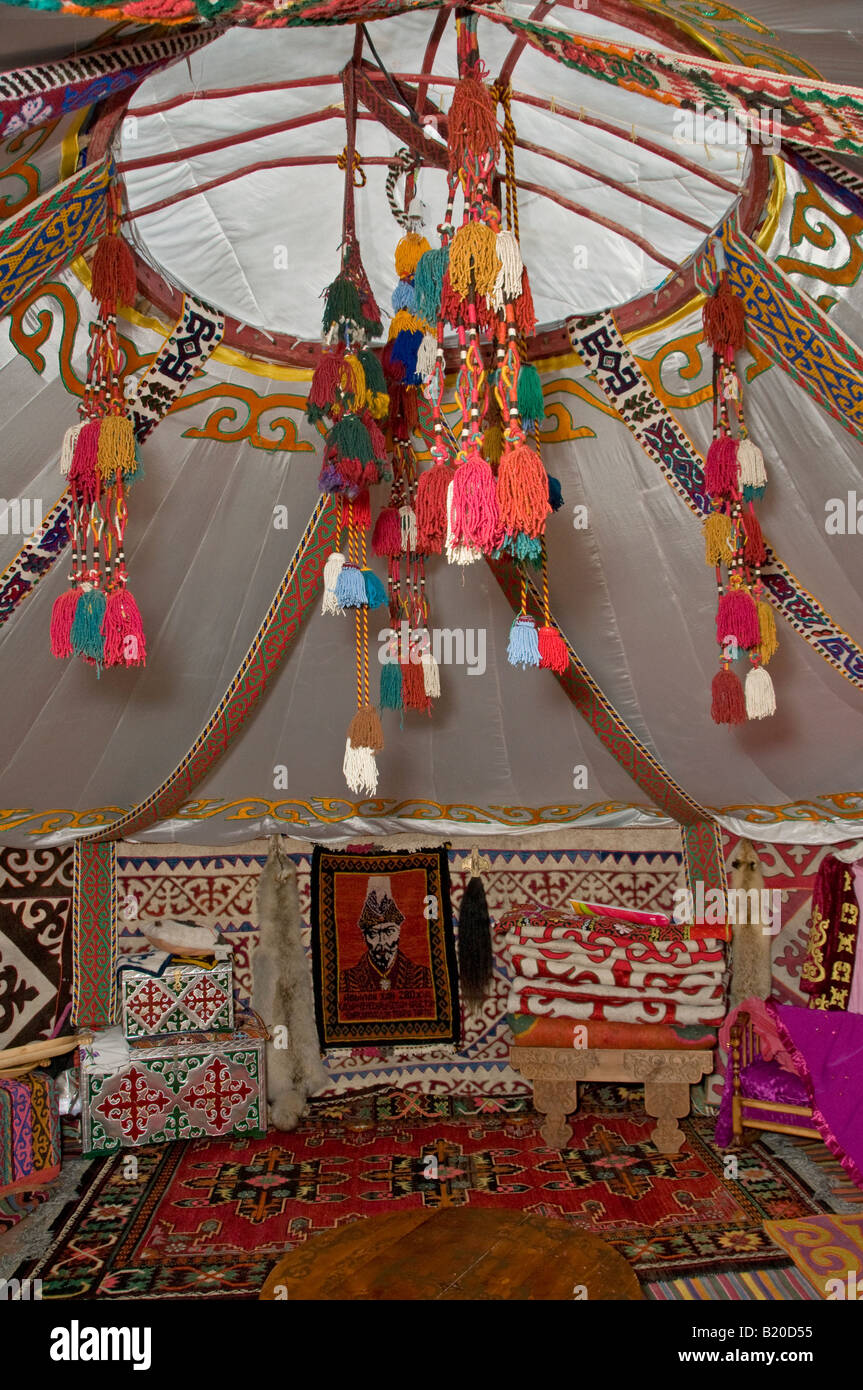 Colorful hand woven woolen band pendants with tassels decorates a traditional yurt or ger round tent used as a dwelling by nomads in Central Asia Stock Photo